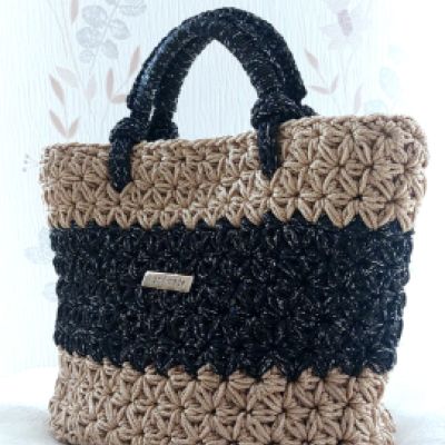 BORSA A MANO BEIGE E GLITTER NERO